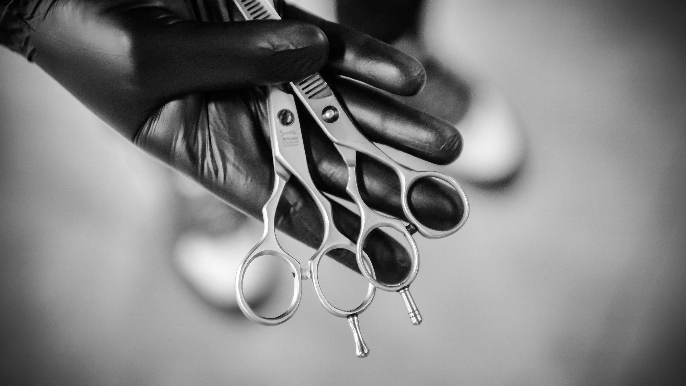 Barber holding scissors